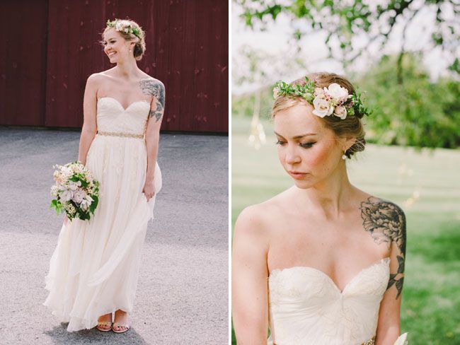 A simple strapless lace wedding dress with an embellished sash and a floral crown