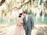 a blush A-line wedding dress with cap sleeves and a square cutout is a very romantic outfit idea for a barn bride