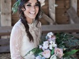 a fitting lace wedding dress with long sleeves and an illusion neckline plus a train