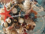a bright wedding bouquet composed of seashells, star fish, pearls and beads looks very original and non-traditional