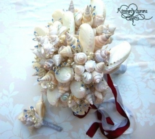 a chic seashell wedding bouquet with pearls and ribbons is a cool idea for a beach wedding