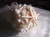 a ball seashell and starfish wedding bouquet for a beach wedding