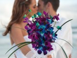 a purple orchid wedding bouquet will add a touch of color to your beach bridal look