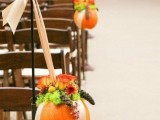pumpkins works well to decorate a fall’s wedding aisle