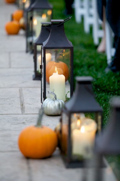 elegant fall wedding aisle decor with candle lanterns and silver and orange pumpkins will work for many wedding styles