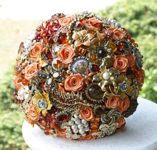 a jaw-dropping fabric flower and brooch wedding bouquet with lots of beads and rhinestones is an amazing idea done fully in fall colors
