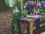a fern, eucalyptus and fir table runner plus extra bold blooms for a woodland wedding tablescape