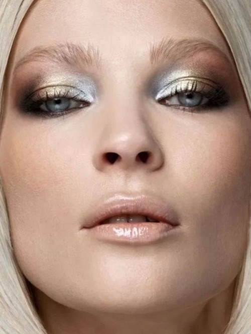 a catchy winter wedding makeup with gold and silver eyeshadow and a glossy pink lip is a beautiful idea to look like an ice queen