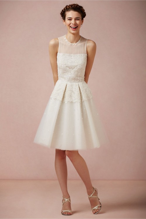 a vintage-inspired A-line sleeveless neutral dress with an illusion neckline, an embellished bodice and a lace applique skirt is a whimsy and creative option