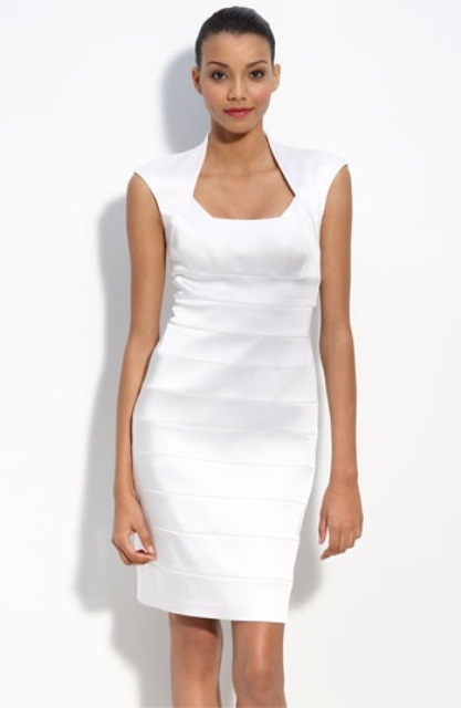 an ultra-modern white fitting over the knee dress with a cool neckline and cap sleeves is a bold idea to rock