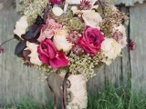 a refined vintage-inspired Valentine wedding bouquet with blush, pink blooms and dark leaves plus a vintage wrap with brooches