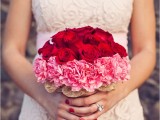 a bold red and pink wedding bouquet of roses and carnations is a statement idea for a Valentine’s Day bride