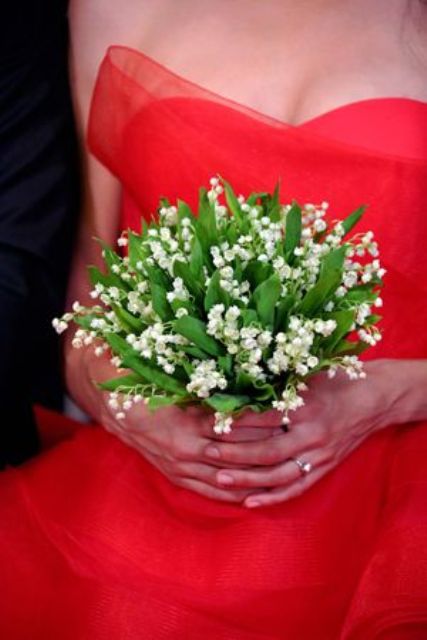 a beuatiful lily of the valley wedding bouquet is a lovely match to a pink or red wedding dress and looks amazing