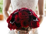 a deer red rose and deep purple callas wedding bouquet is a lovely and bold idea for a Valentine bride, it looks refined and decadent