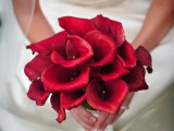 a red calla wedding bouquet is traditional elegance and chic that will fit not only a Valentine bride but also any other