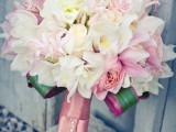 a romantic light pink and white wedding bouquet with a pink ribbon wrap is a beautiful and chic idea to rock