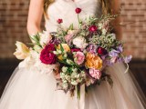 a bright and cool multi-color wedding bouquet in lavender, blush, yellow, fuchsia and red, with whimsical leaves and greenery