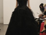 a dramatic black wedding ballgown with a croset, a large fabric floral and a layered skirt for a Halloween wedding