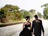 a strapless black wedding dress with a draped bodice and a ruffle skirt is a stylish idea for a modern black wedding