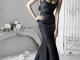 a black mermaid wedding dress with thick straps and a square neckline plus a wide sash and a statement necklace