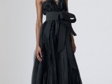 a strapless A-line black wedding dress with a ruffle bodice and skirt, a widesash with a bow for a refined bride