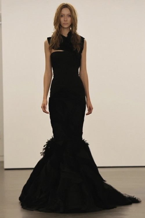 a refined black mermaid wedding dress with a feather tail and a cutout bodice plus no sleeves is amazing