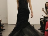a beautiful mermaid black wedding dress with no sleeves, a deep neckline, a layered tulle tail for a Halloween wedding