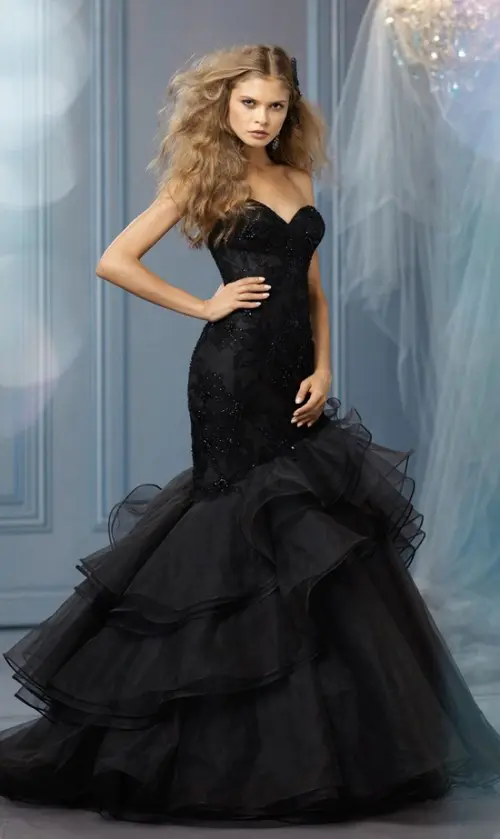 a refined black embellished strapless wedding dress with a tulle skirt and a train for a sophisticated wedding