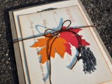 a chic and bright wedding invitation suite with bold fall leaves and a painted tree