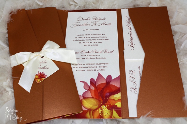 A bold fall wedding invitation suite on chocolate brown with bright fall blooms printed and a creamy bow