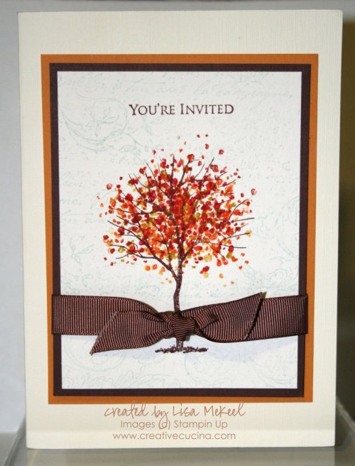 a stylish wedding invitation suite with a bright printed fall tree and a brown ribbon bow