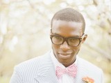 a very elegant mix of prints, a thin striped suit, a white shirt and a plaid bow tie for summer