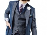 a dapper look for not a hot day, a grey and blue three-piece suit, a polka dot shirt and a striped tie