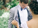 a stylish groom’s look with a retro feel added with suspenders and a printed bow tie