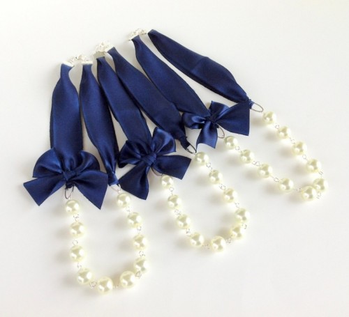 pearl necklaces with navy ribbons are chic accessories for bridesmaids or even a bride
