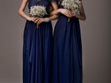 navy maxi bridesmaid dresses with lace bodices and baby’s breath bouquets for a bold and chic look