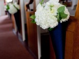 navy cones with white hydrangeas will accent your wedding aisle at their best