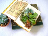 a vintage book used as a planter for succulents is a cute idea for a nerdy or book-loving wedding