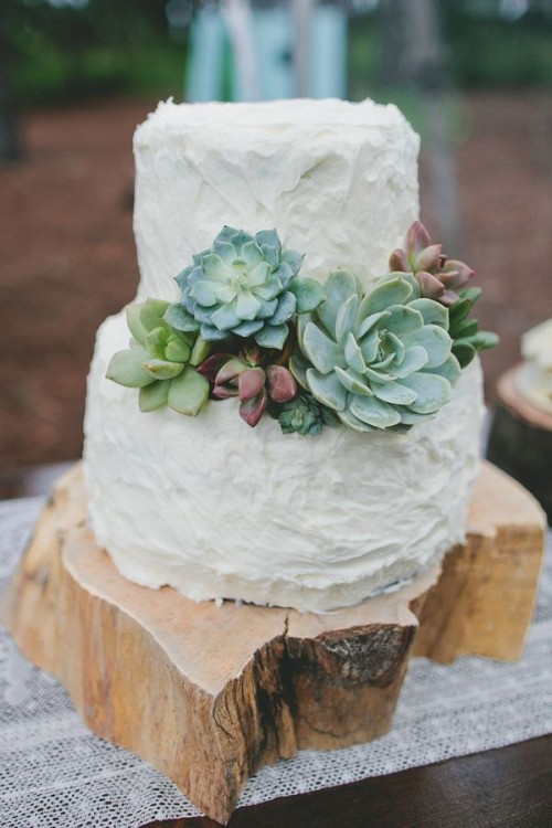 a textural buttercream wedding cake decorated with usual and dark succulents is a stylish idea for a rustic wedding