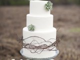 a sleek white buttercream wedding cake decorated with succulents and twigs is a lovely solution for a desert or boho minimmalist wedding