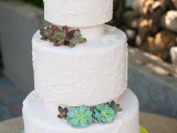 a textural pattern three tier wedding cake with various succulents in between the tiers is a lovely and cool idea for a modern wedding