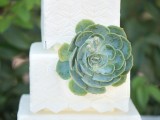 a white buttercream square wedding cake with patterns and large fresh succulents is a cool solution for a modern wedding