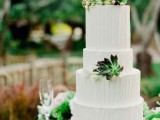 a white textural buttercream wedding cake decorated with succulents and moss is a lovely idea for any modern wedding, whatever its style is