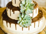 an amazing wedding cake with chocolate drips
