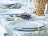 a neutral summer wedding tablescape with neutrla porcelain, linens, lavender and a statement lavender centerpiece