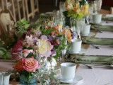 a chic vintage-inspired summer wedding tablescape with beautiful and tender florals, white and green linens and some dried elements