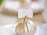 a gilded pumpkin card holder works as a Thanksgiving wedding favor or just as decor and can be used for any fall wedding