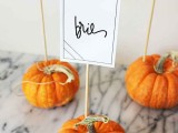 natural orange pumpkins with cards are ideal for Thanksgiving or just fall wedding