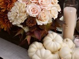 a chic fall or Thanksgiving tablescape with rust and blush blooms, blush candles and white pumpkins is a great idea