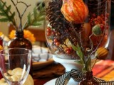 a bright fall or Thanksgiving tablescape with greenery, faux berries, pinecones, greenery and some dried blooms will do for a party in vintage style